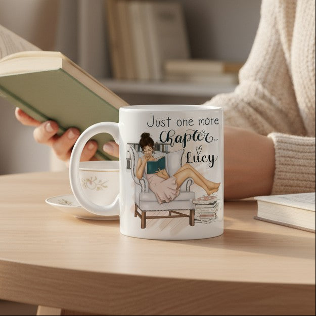 Person reading a book with a mug on a table in a cosy living room.